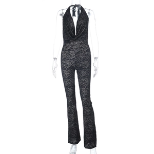 Close-up of intricate black lace fabric and halter neck detail on backless jumpsuit