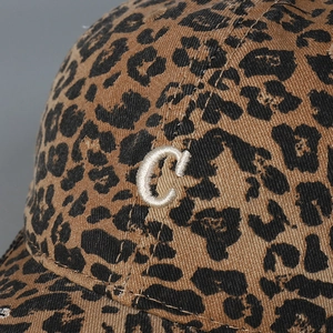Detailed close-up of leopard print baseball cap with white 3D embroidered C letter
