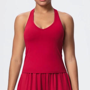 Detail of red sports tank top and pleated skirt set for tennis or golf workouts