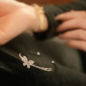 Silver butterfly open bracelet with pavé cubic zirconia inlay in a luxury jewelry style