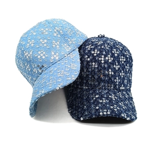 Stylish denim baseball caps with sequin floral patterns in light and dark blue shades