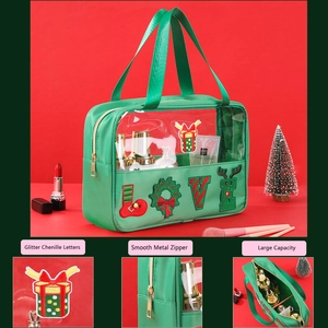 Detail of green Christmas makeup bag with glitter chenille letters and metal zipper