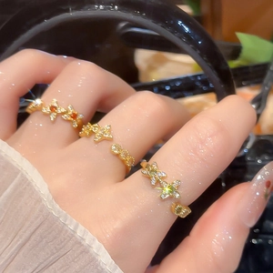Detail of 18k gold plated flower star rings with micro-inlaid colorful zircons