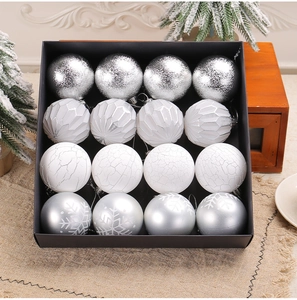 Detail of 16-pack silver and white Christmas balls with glitter and geometric textures