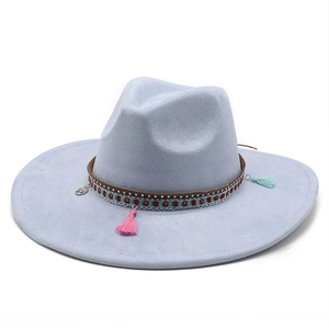 Detail of light blue wide brim felt hat with bohemian braided band and charms