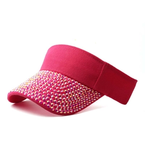Detail of pink visor cap with sparkling colorful rhinestones on the brim for women