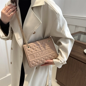 Chic beige embossed crossbody bag with gold chain strap and FASHION lettering