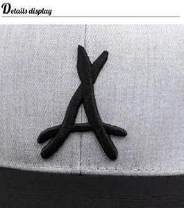 Close-up of a 3D black letter A embroidery on a grey fabric sports baseball cap