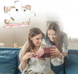 Detailed acrylic puzzle ornament with pink floral patterns and sisterhood message