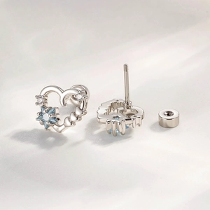 Silver hollow heart stud earrings with blue star zircon and clear stones for women