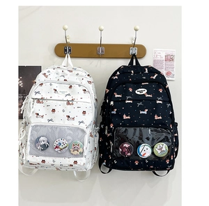Detail of the transparent window compartment on dachshund print student backpacks