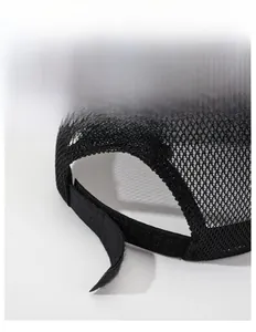 Detail of breathable mesh back and adjustable velcro strap on black trucker cap