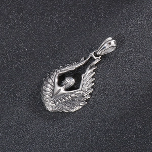 Detailed view of titanium steel angel wing pendant with intricate feather textures