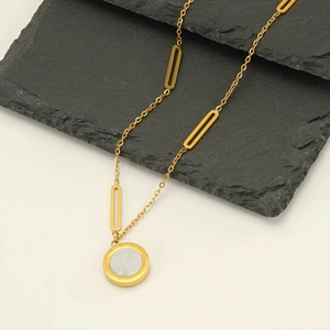 Golden stainless steel necklace with round white pendant and Roman numeral engravings