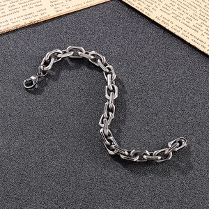 Close-up of vintage stainless steel O-chain bracelet with lobster clasp and aged finish