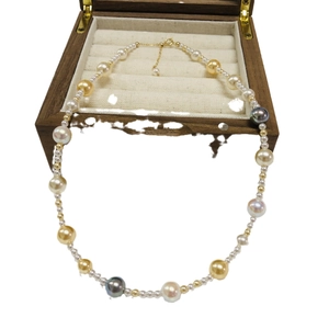 925 silver multicolor pearl necklace with white, gold, and grey pearls in a wooden box