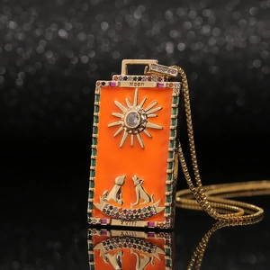 Golden Tarot Moon pendant necklace with orange enamel and sun motif on box chain