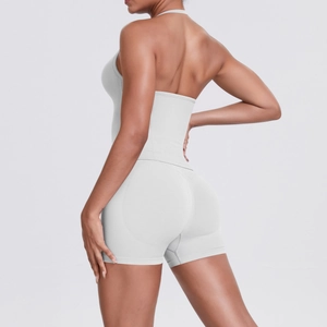 Detailed back view of a grey halter neck yoga top and high-waisted seamless fitness shorts