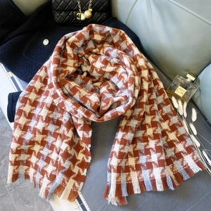 Detail of retro rust orange houndstooth scarf with soft fringe and thick cashmere feel