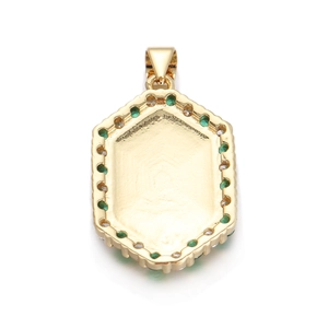 Detailed macro view of a gold hexagonal pendant set with green and clear zircon stones