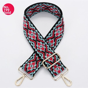 Close-up of bohemian geometric pattern canvas strap with polished gold metal lobster clasps