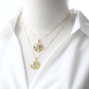 Elegant gold-plated necklaces with round letter A and L pendants featuring CZ stones