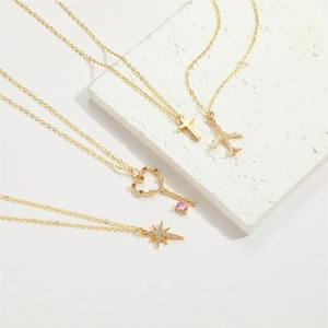 Minimalist 14K gold plated choker necklaces featuring cross, airplane, heart and star charms