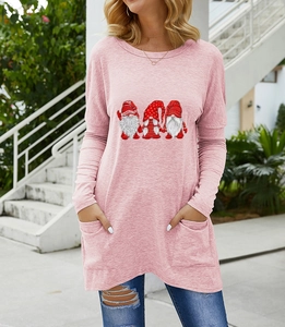 Detail of pink long sleeve shirt with holiday gnomes print and functional side pockets