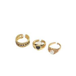 Gothic open rings set with blue gemstone, black heart, and pearl in gold finish