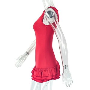Detail of red sleeveless dress featuring tiered ruffle hem and pleated knit texture