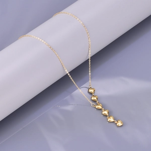 18K gold plated stainless steel necklace featuring vertical cascading heart pendants