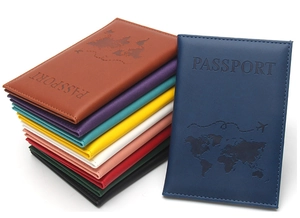 Macro view of multi-color PU leather passport covers with embossed world map and logo