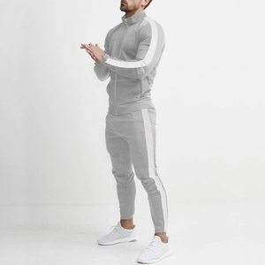 Detail of light grey tracksuit with stand collar and white side stripes on sleeve and leg