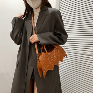Brown bat-shaped PU leather crossbody bag with white spider web embroidery detail
