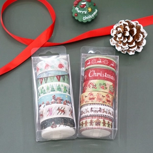 Close-up of 6-pack Christmas washi tape sets featuring festive reindeer and snowflakes