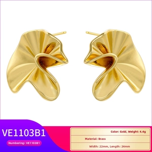 Detailed macro view of gold-tone irregular pleated leaf brass stud earrings 22mm x 24mm