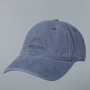 Close-up of GABENARA embroidery and washed fabric texture on grey-blue baseball cap