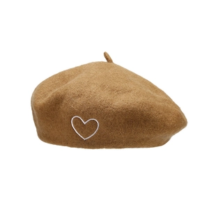 Classic camel wool beret featuring a delicate white heart embroidery in a retro style