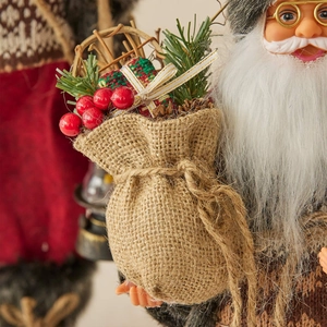 Standing Santa Claus linen doll ornament with red berries and burlap gift bag decoration