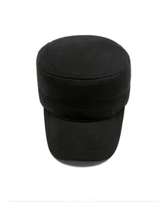 Top view of men's winter flat top cap in black wool with golden metal crest detail