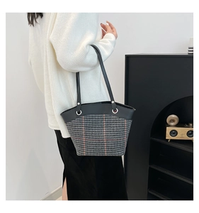 Side view of contrast stripe tote bag showing large capacity and textured fabric