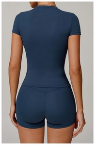 Rear view of a navy blue quick-dry compression t-shirt and slim fit yoga shorts set