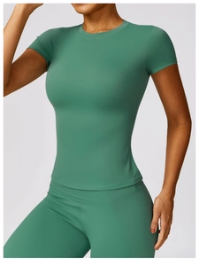 Detail of high-stretch quick-dry green yoga suit showing tight fit and elastic fabric