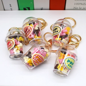Miniature colorful popcorn bucket keychains with star charms and gold lobster clasps