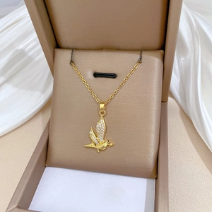 Luxurious gold-plated swallow pendant necklace with shimmering crystals in a gift box