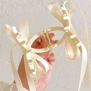 Matte cream bow hair claw clip with long elegant ribbons for women stylish hair styling