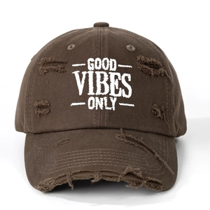 Close-up of brown cotton baseball cap with GOOD VIBES ONLY embroidery and distressed details