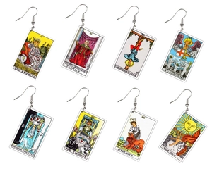 Macro view of double-sided acrylic tarot earrings featuring eight vintage artistic patterns