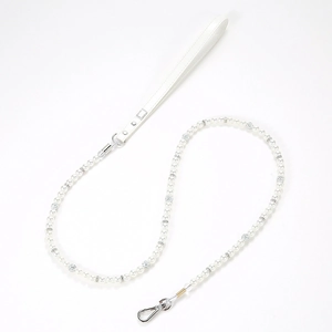 Detail of luxury white pearl pet leash with silver buckle and white leather handle
