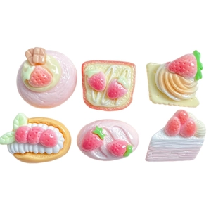 Set of six cute resin strawberry cake dessert charms for DIY crafts on white background